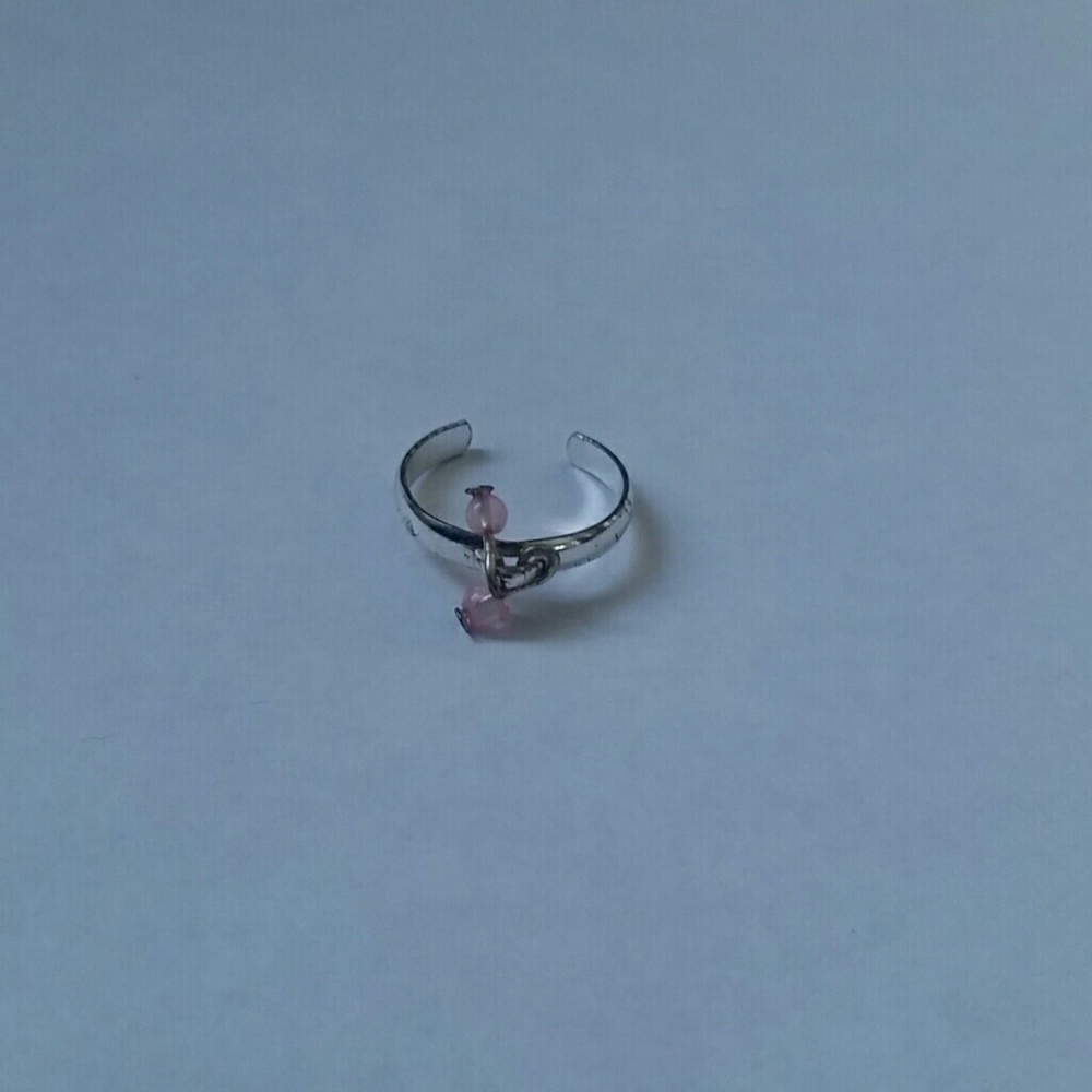 Silver ring with pink beads